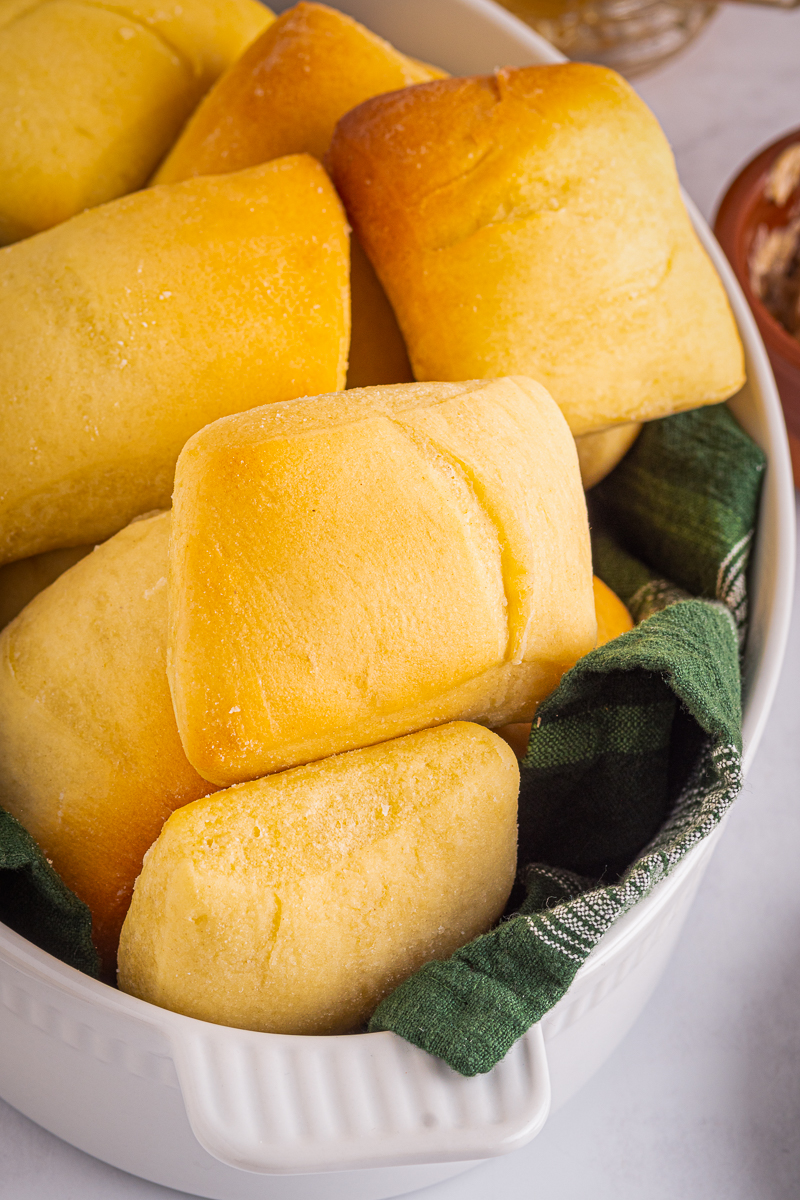golden, fluffy sweet rolls with a linen