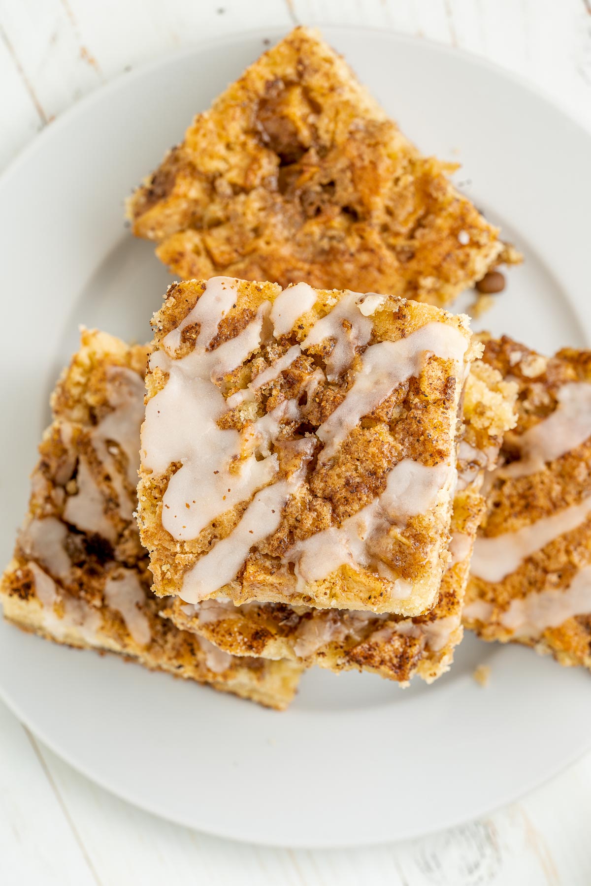 stack of apple cake slices on a white plate