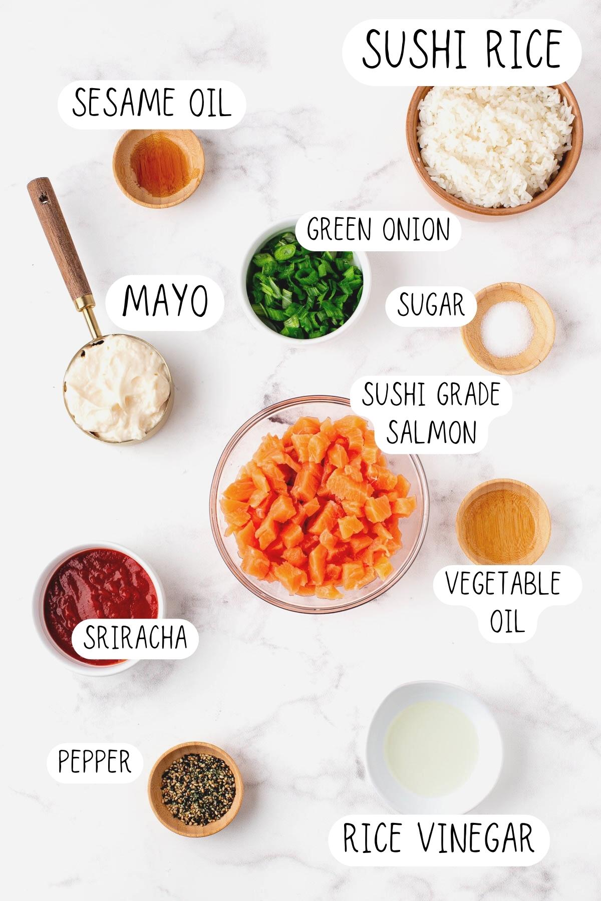 ingredients for salmon bites, including rice, sesame oil, green onion, Sriracha